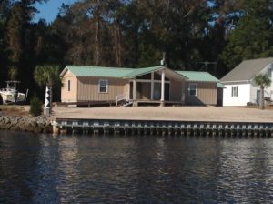 House on Adams Creek Canal with sand beach and palm trees