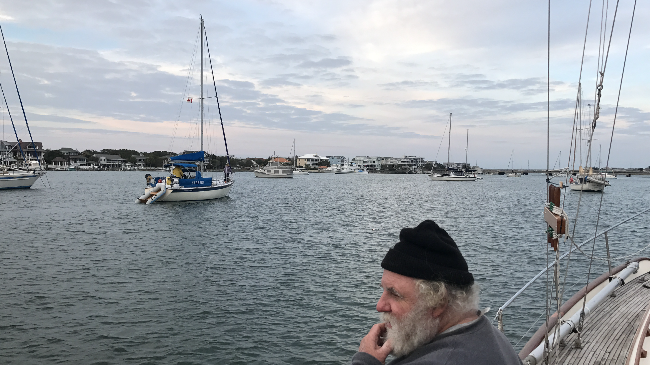 I study the crowded anchorage at Wrightsville Beach